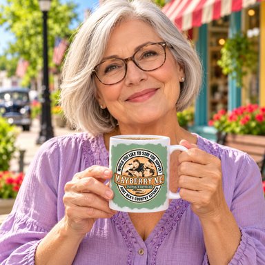 Model enjoying coffee with Aunt Bea's Country Kitchen Mug on Mayberry Main Street