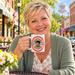 Model enjoying coffee with Aunt Bee's Kitchen Cherry Gingham Mug on Mayberry Main Street
