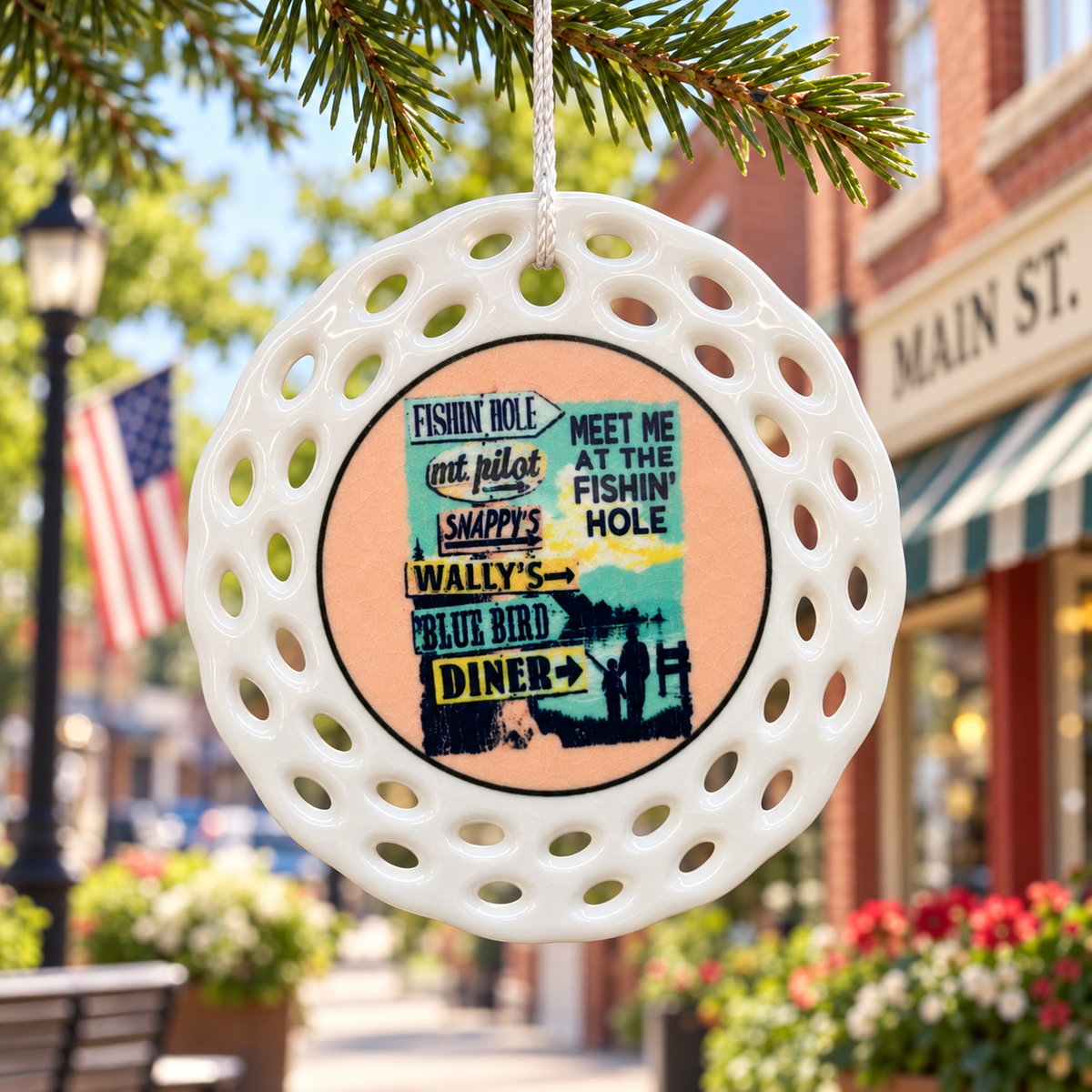 Meet Me at the Fishin Hole ceramic ornament displayed on Main Street