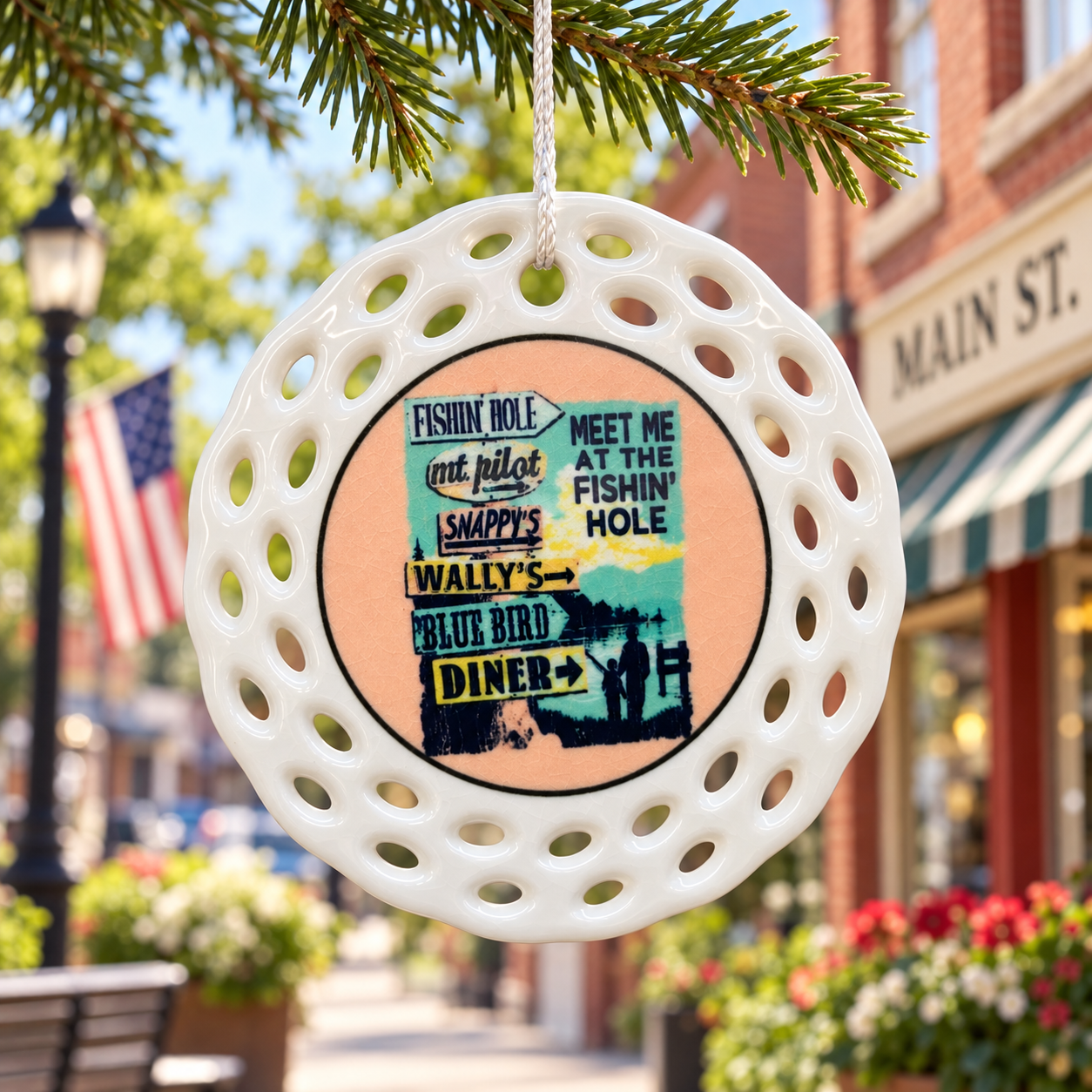 Meet Me at the Fishin Hole ceramic ornament displayed on Main Street