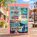 Meet Me at the Fishin Hole signpost sticker displayed on Main Street