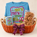Hootin' Tootin' Harvest in a burnt orange canoe-shaped wicker basket with owl T-shirt, owl mug, and ten-count pralines — styled preview