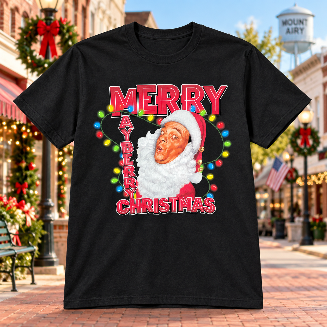 Merry Mayberry Christmas T-Shirt in Black against a bright Mayberry Main Street background