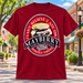 Mayberry Pork Chop Sandwich T-Shirt in Red against a bright Mayberry Main Street background