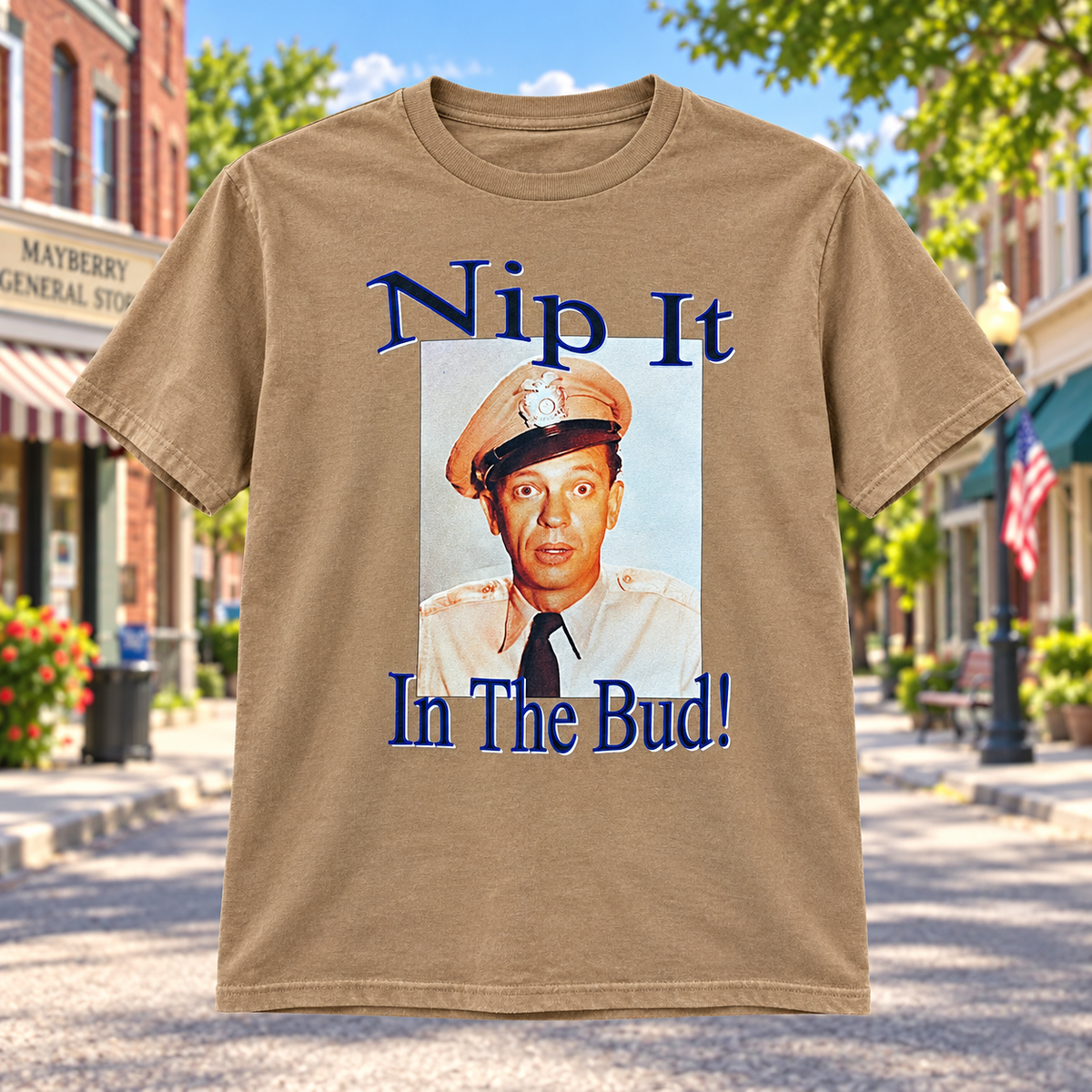 Nip It in the Bud T-Shirt in Tan against a bright Mayberry Main Street background