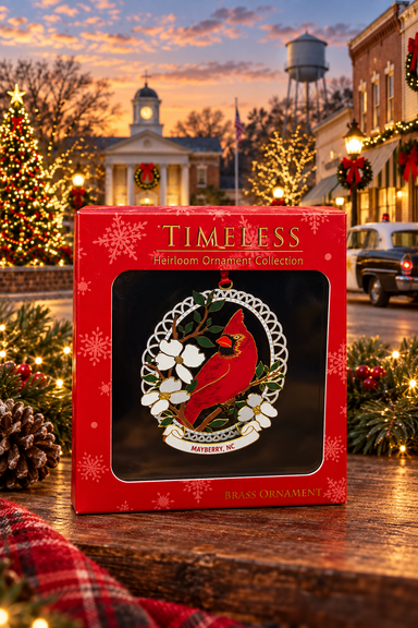 Cardinal and Dogwood Mayberry ornament in its red gift box against a festive Mayberry-themed backdrop