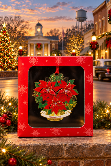 Poinsettia Mayberry ornament in its red gift box against a festive Mayberry-themed backdrop