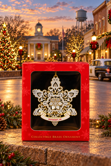 Snowflake Mayberry ornament in its red gift box against a festive Mayberry-themed backdrop