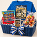 Mayberry Game Night in a Navy blue wide rectangular open wicker hamper with inset handholds — styled preview