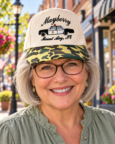 Model wearing Mayberry Hat 10 on a Mayberry-style downtown street