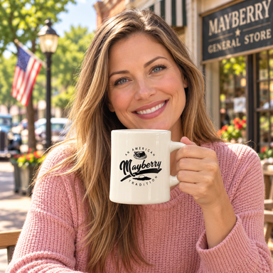 Model enjoying coffee with Mayberry Mug 28 on Mayberry Main Street