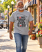 Man walking on Mayberry Main Street wearing Gone Fishin’ with Andy & Opie Tee