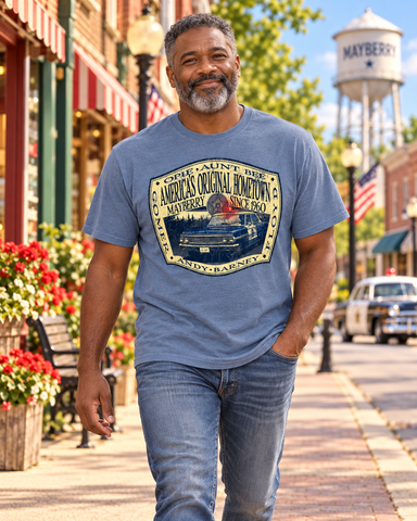 Man walking on Mayberry Main Street wearing Mayberry America’s Original Hometown Tee
