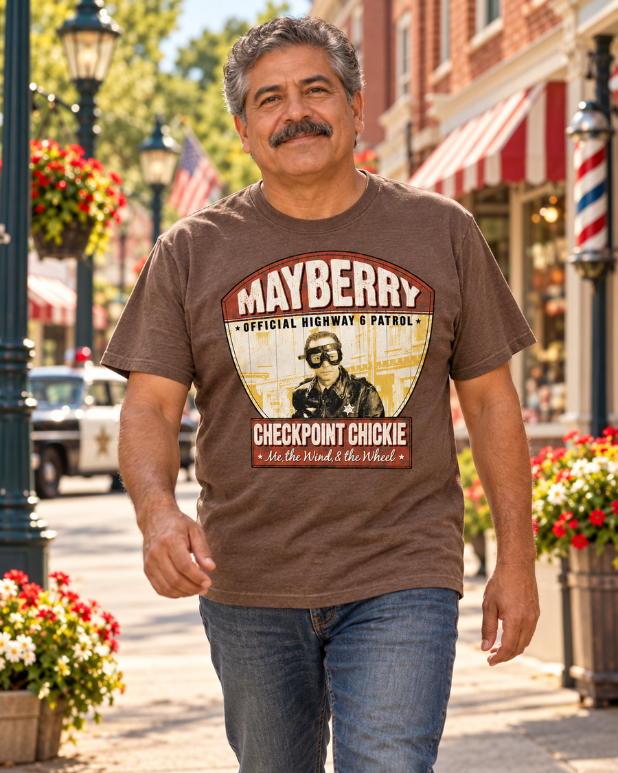 Man walking on Mayberry Main Street wearing Checkpoint Chuckie Mayberry Tee