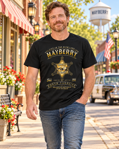 Man walking on Mayberry Main Street wearing Mayberry Life in the Slow Lane Sheriff Badge Tee