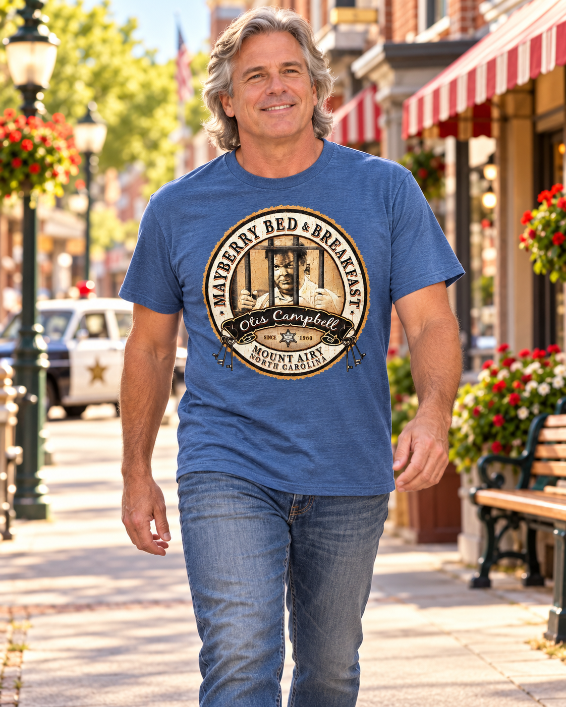 Man walking on Mayberry Main Street wearing Otis Campbell Mayberry Bed & Breakfast Tee