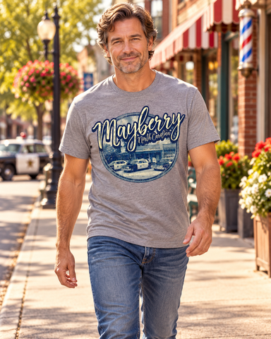 Man walking on Mayberry Main Street wearing Mayberry Wally’s Service Tee