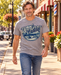 Man walking on Mayberry Main Street wearing Mayberry Wally’s Service Tee