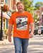 Man walking on Mayberry Main Street wearing Loaded Goat Mayberry Tee