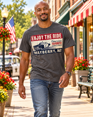 Man walking on Mayberry Main Street wearing Enjoy the Ride Mayberry Tee